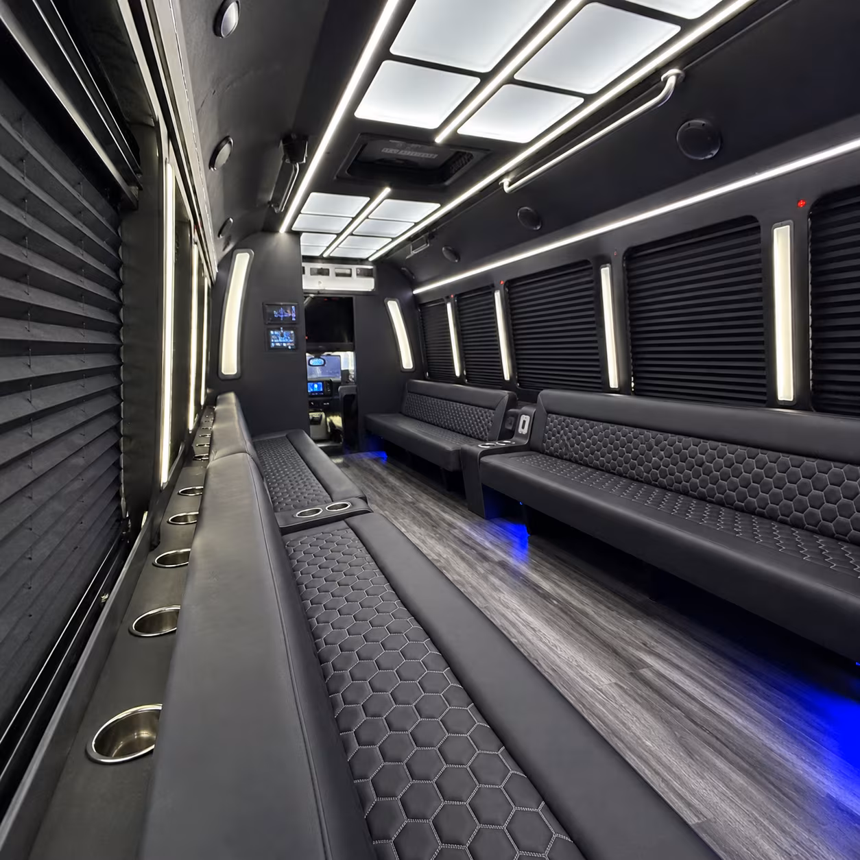 Group beside a Mercedes Sprinter limo in Huntsville